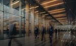 people walking in building lobby