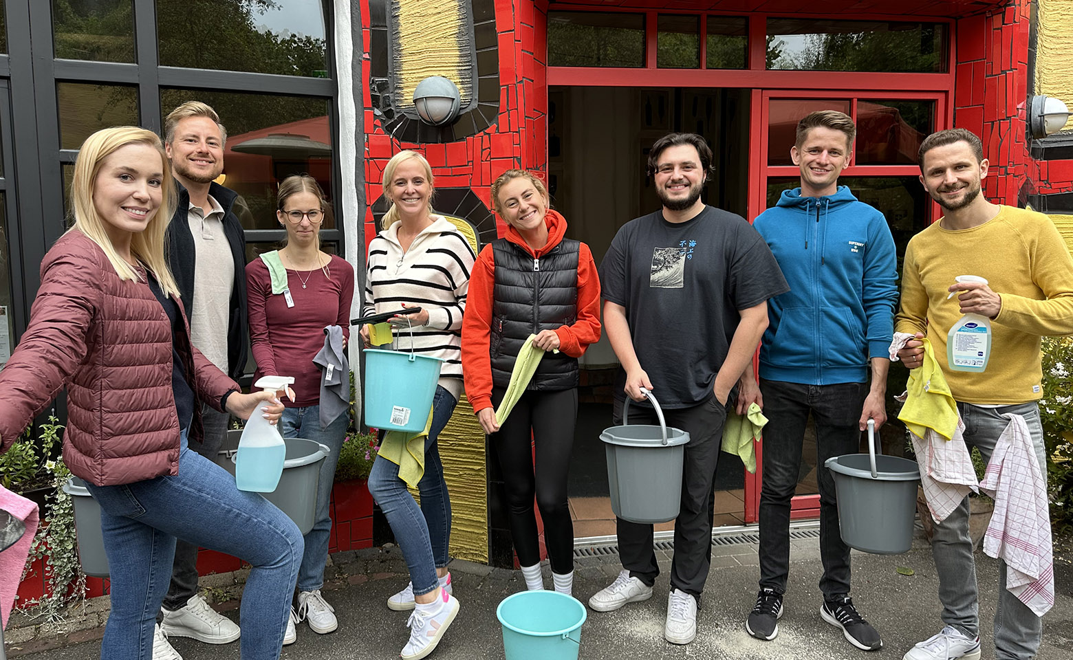 Group of people with cleaning equipment