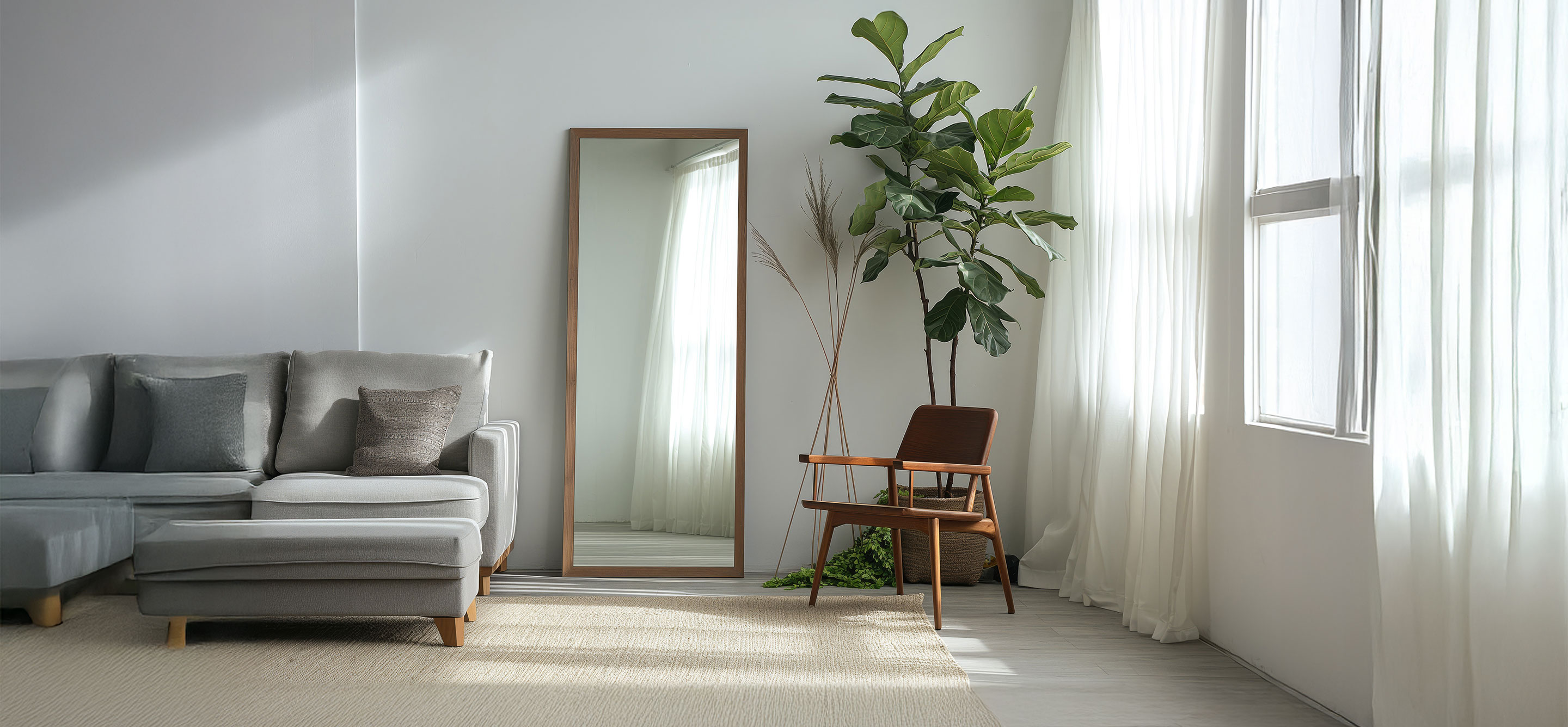 Living room with sofa, mirror, wooden chair and plant
