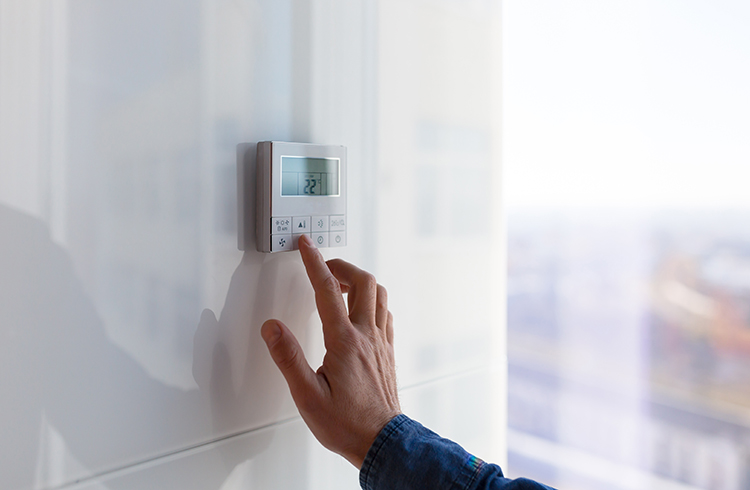 The air conditioning and heating control panel for the office on a white wall