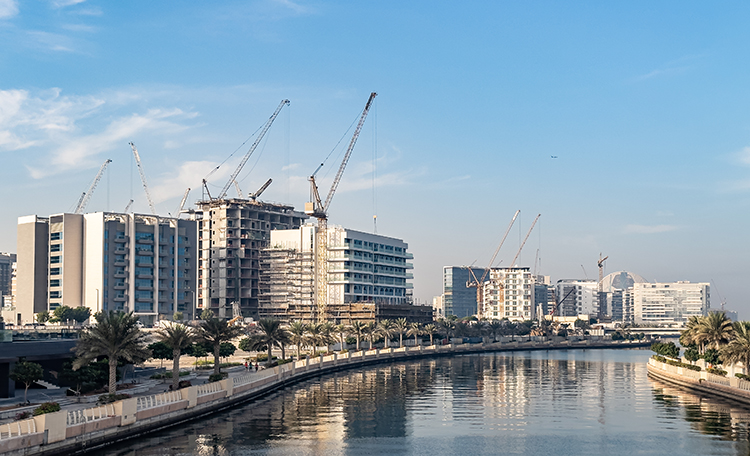 Residential apartment buildings under construction along the waterfront promenade