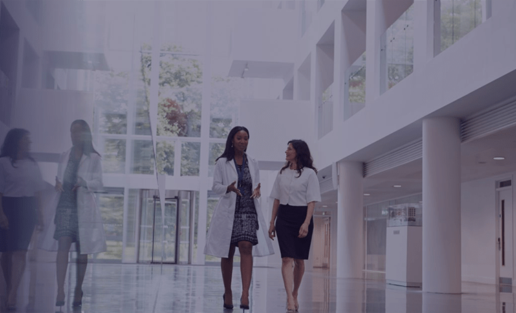 Women walking in hospital corridor