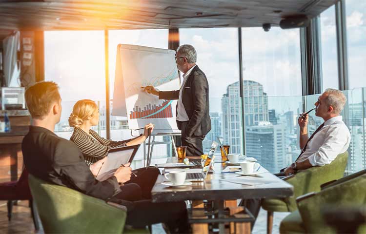 A group of diverse colleagues working together in the conference room
