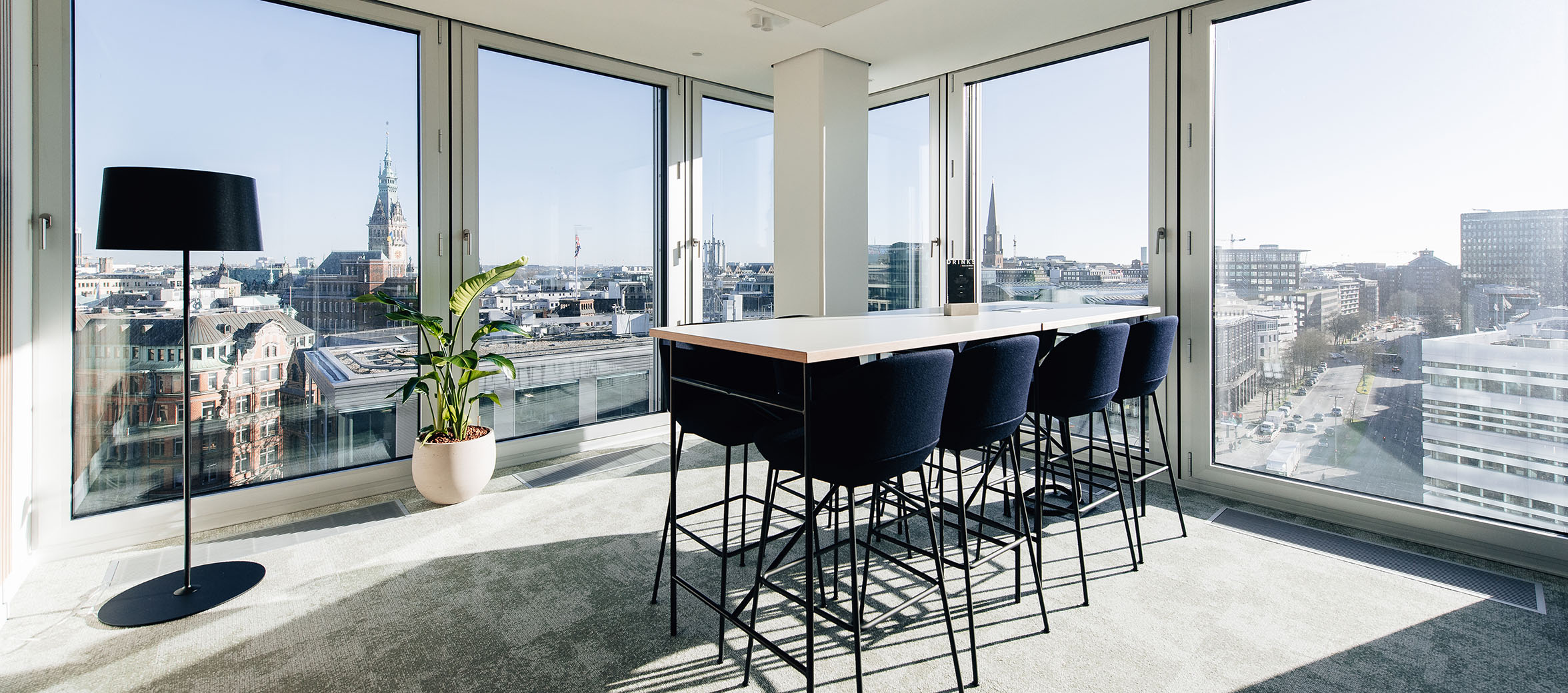 Dining area with a view of the Speicherstadt from Hamburg Office in TRIIIO building