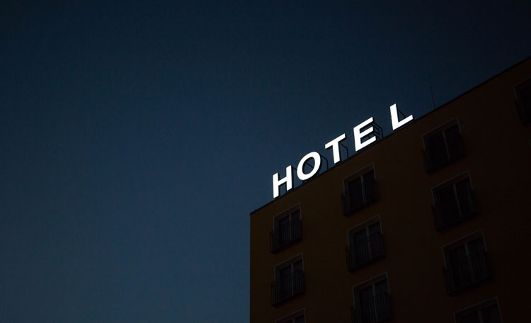 Hotel sign lit up at night